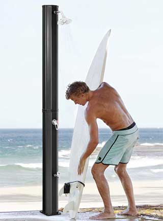 Using an Outdoor Solar Shower to Rinse Off Sand